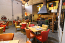 Le Patio Mauguio restaurant de grillades au feu de bois et l'immense cheminée dans la salle (® Le Patio)